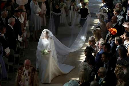 Markle walked down the aisle in St George's Chapel, Windsor Castle, on her own before being accompanied to the altar by Prince Charles ( Danny Lawson (POOL/AFP) )