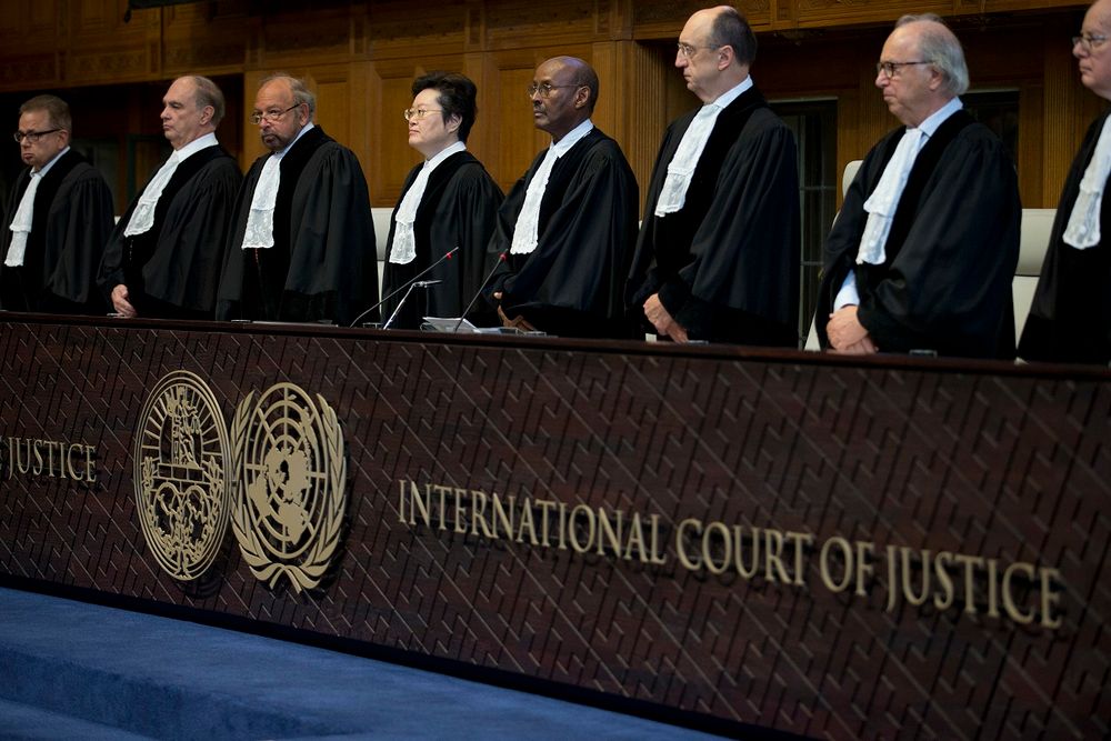 Judges enter the International Court of Justice, or World Court, in The Hague, Netherlands, Wednesday, Oct. 3, 2018, where they ruled on an Iranian request to order Washington to suspend U.S. sanctions against Tehran.