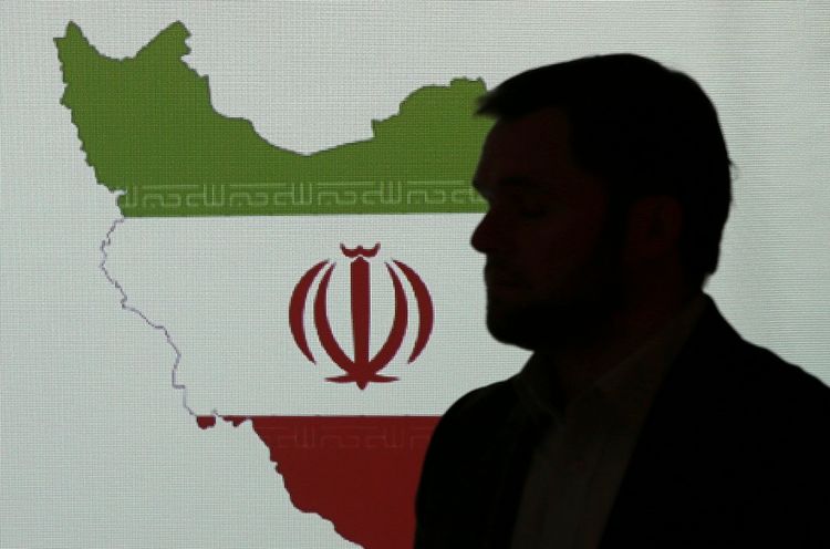 Stuart Davis, a director at one of FireEye's subsidiaries, stands in front of a map of Iran as he speaks to journalists about the techniques of Iranian hacking, Wednesday, Sept. 20, 2017, in Dubai, United Arab Emirates. A new report by FireEye, a cybersec
