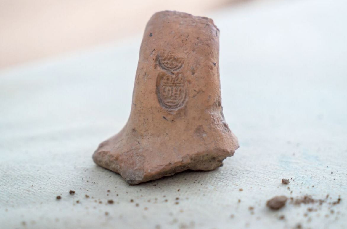 A stamped jar handle dating to the Middle Bronze Age.