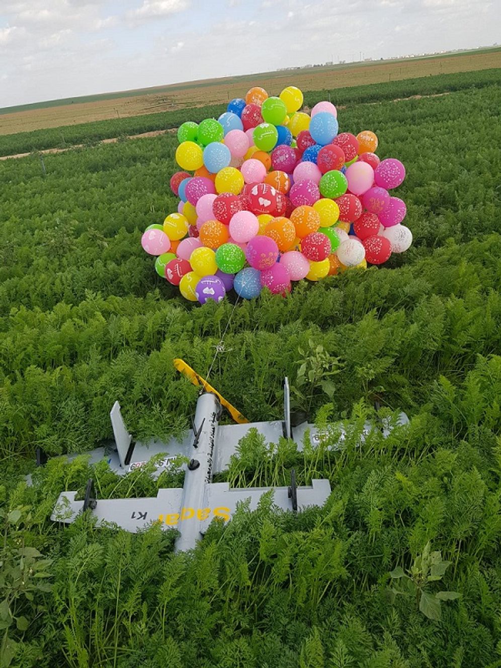 Incendiary toy drone attached to balloon cluster on Gaza border