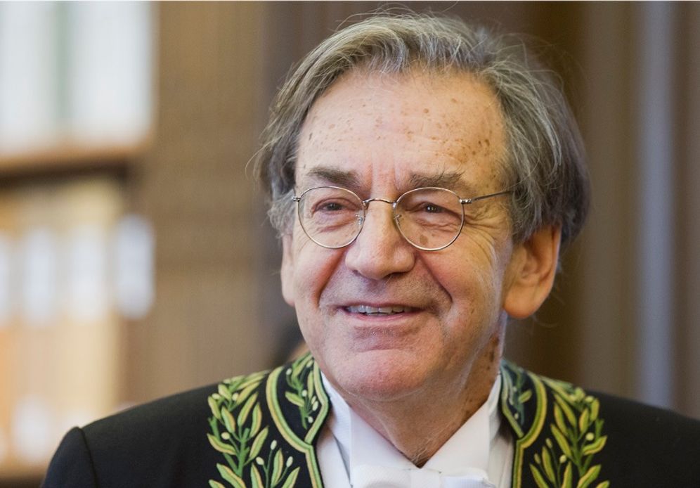 (AP Photo/Jacques Brinon) FILE: French Philosopher Alain Finkielkraut, wearing the French Academician's outfit, displays his ceremonial epee in the library of the Institut de France before a ceremony in Paris, Thursday Jan 28, 2016.