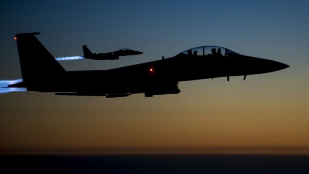 A pair of US Air Force F-15E Strike Eagles flying over northern Iraq early in the morning of September 23, 2014 after conducting airstrikes in Syria