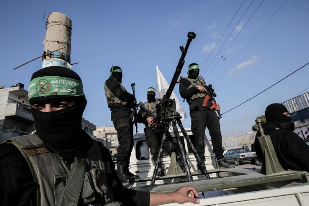 Members of the Ezzedine al-Qassam Brigades, the military wing of the Palestinian Islamist movement Hamas, take part in a rally marking the 29th anniversary of the creation of the movement on December 16, 2016