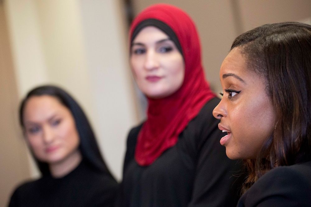 Tamika Mallory, right, co-chair of the Women's March on Washington, talks during an interview Jan. 9, 2017 with fellow co-chairs Carmen Perez, left, and Linda Sarsour, in New York.