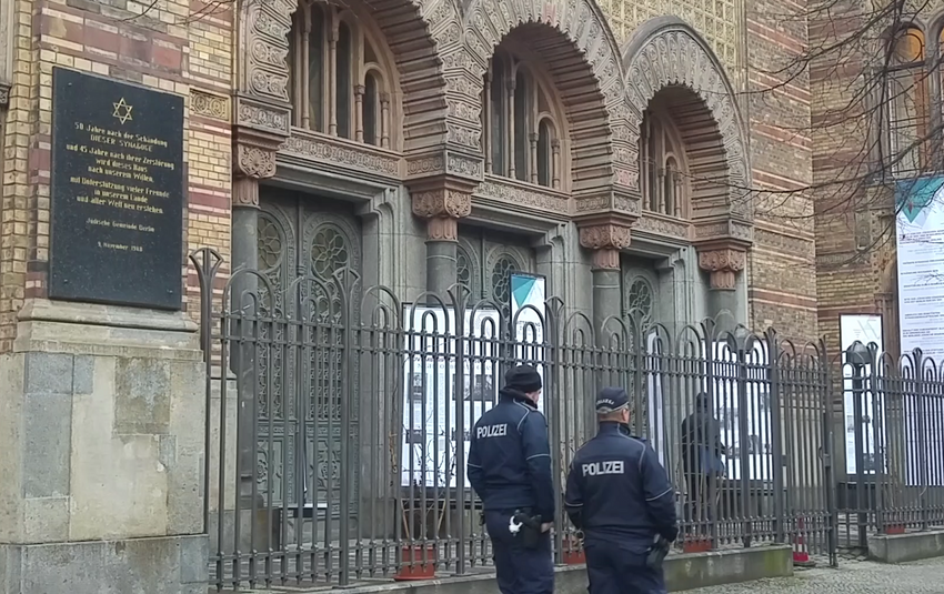 Police patrol in front of the A police guard booth stands in front of the New Synagogue, Berlin