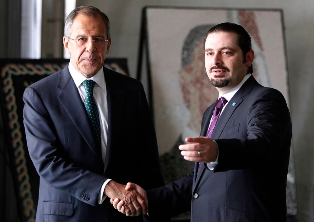 FILE: Russian Foreign Minister Sergey Lavrov, left, shakes hands with then Lebanese majority leader, lawmaker Saad Hariri, right, at the grave of slain former Prime Minister Rafik Hariri in downtown Beirut, Lebanon, on Monday May 25, 2009.