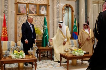 FILE: Saudi King Salman, second right, invites U.S. President Donald Trump to sit during a meeting at the Gulf Cooperation Council Summit, at the King Abdulaziz Conference Center, Sunday, May 21, 2017, in Riyadh, Saudi Arabia. Trump will use the nation th