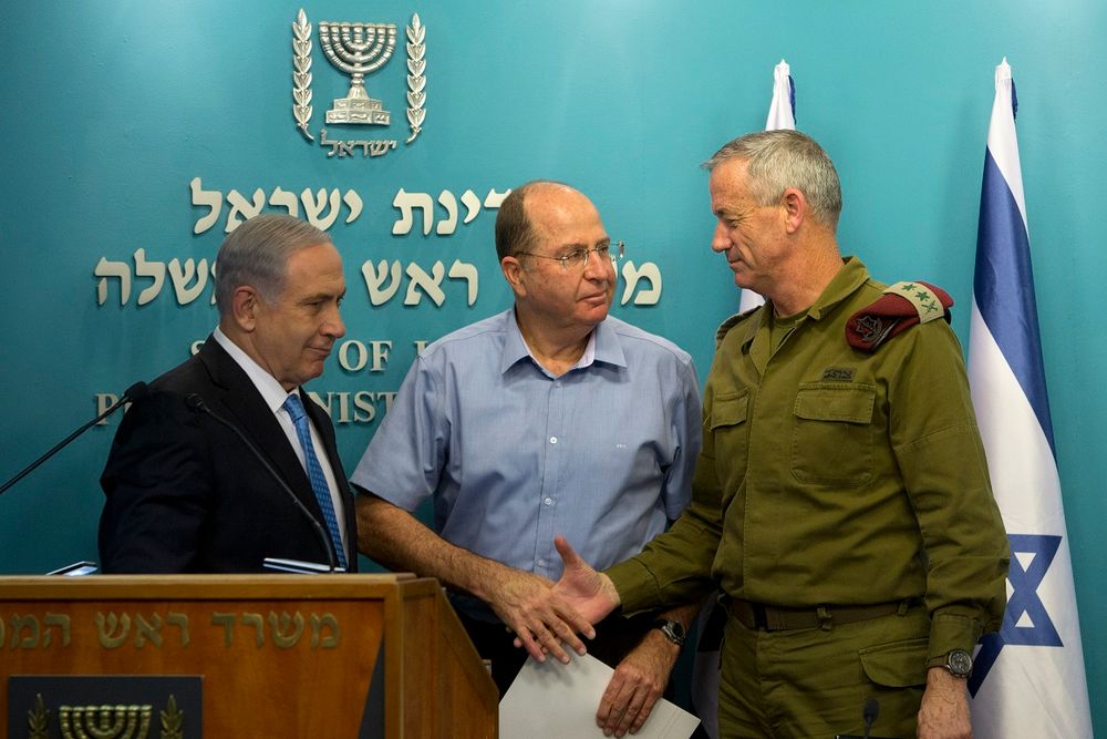 Israel's Prime Minister Benjamin Netanyahu (left) stands with former Defense Minister Moshe Yaalon (center) and former Chief of Staff Lt. Gen. Benny Gantz,