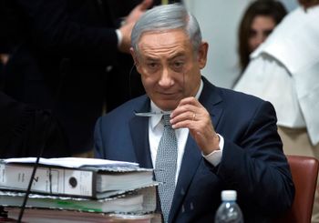 FILE- Israeli Prime Minister Benjamin Netanyahu sits with a stack of documents as he waits for the Supreme Court to convene in Jerusalem, Sunday, Feb. 14, 2016. Netanyahu made an unprecedented appearance at the Supreme Court to defend a deal signed in Dec