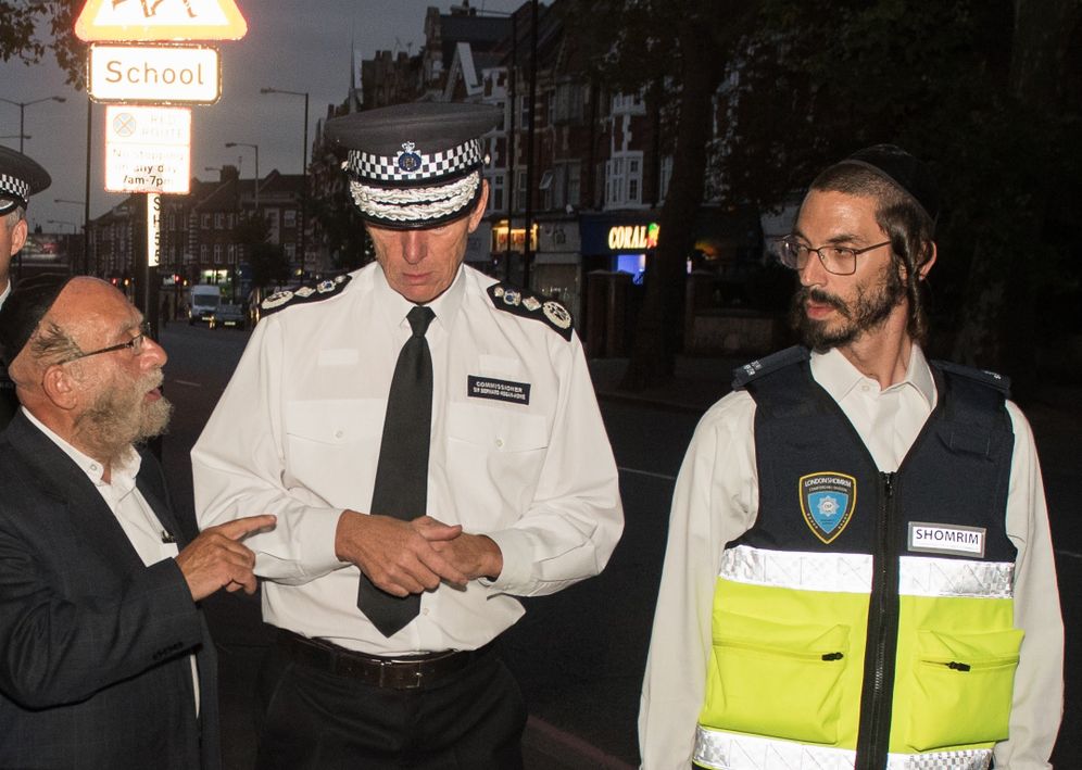 Shomrim Barry Bard from Stamford Hill Shomrim patrols with Sir Bernard Hogan-Howe, Commissioner of Police of the Metropolis.