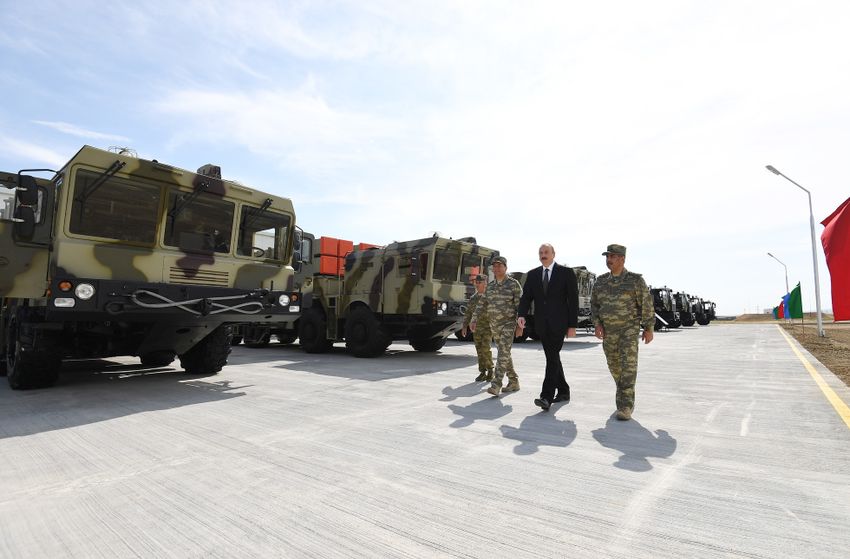 Azerbaijani President Ilham Aliyev walks in front of the Israeli-made LORA artillery system at a military base on June 11 2018.