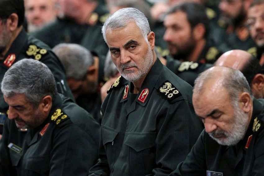 FILE- In this Sept. 18, 2016 photo released by an official website of the office of the Iranian supreme leader, Revolutionary Guard Gen. Qassem Soleimani, center, attends a meeting with Supreme Leader Ayatollah Ali Khamenei and Revolutionary Guard command