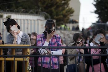 Ultra-orthodox Jewish women take part in prayers near the grave of Rabbi Shimon Bar Yochai during Lag Ba'Omer celebrations at Mt. Meron in northern Israel, early Sunday, April 28, 2013. Tens of thousands of worshippers gathered to celebrate Lag Ba'Omer wh
