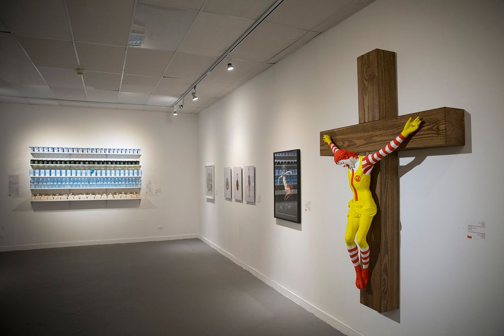 An artwork called "McJesus," which was sculpted by Finnish artist Jani Leinonen and depicts a crucified Ronald McDonald, is seen on display as part of the Haifa museum's "Sacred Goods" exhibit, in Haifa, Israel, Monday, Jan. 14, 2019. Hundreds of Christia