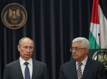 Russian President Vladimir Putin, left, and Palestinian President Mahmoud Abbas, right, hold a joint media briefing following their meeting in the West Bank town of Bethlehem, Tuesday, June 26, 2012.