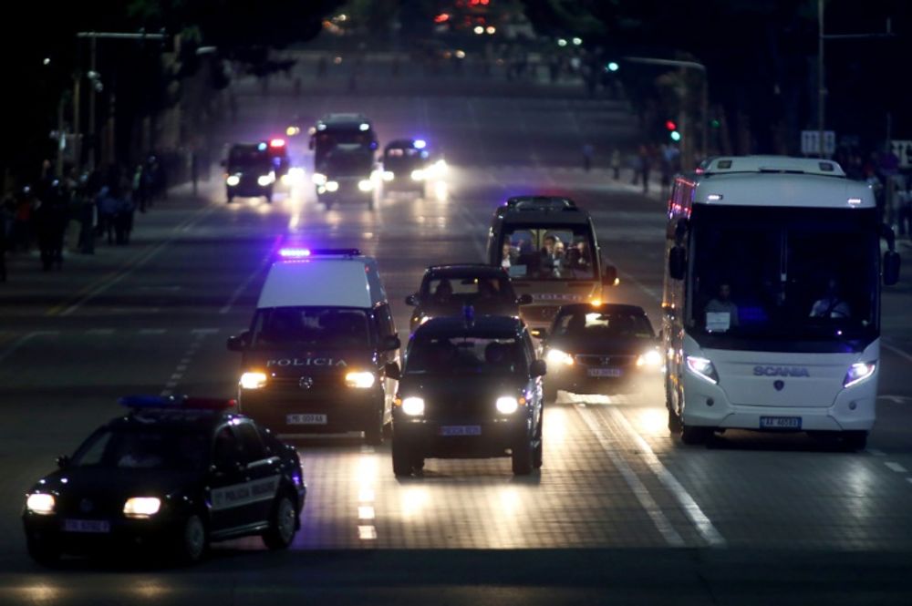 The bus of Serbia’s football team is escorted by Albanian police cars in Tirana on October 7, 2015, as authorities enforce tough security measures ahead of the Euro 2016 qualifying football match between Albania and Serbia on October 8