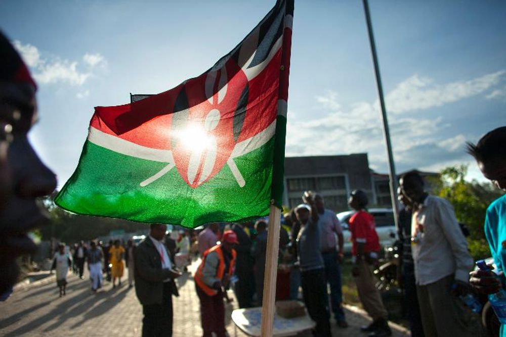 A supporter of Kenyan presidential candidate Uhuru Kenyatta sells Kenyan flags at the Catholic University on March 9, 2013 in Nairobi