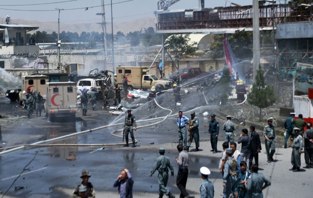 Shah Marai (AFP) Firefighters battle a fire at the site of the blast at the entrance to Kabul airport on August 10, 2015