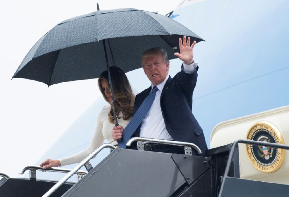 US President Donald Trump and First Lady Melania Trump disembark from Air Force One upon arrival at Newark Liberty International Airport in Newark, New Jersey, July 14, 2017, following a two-day trip to Paris for Bastille Day
