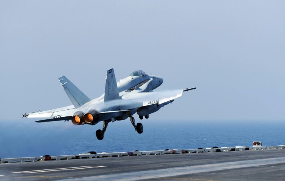 A US Navy handout photo shows an F/A-18C Hornet jet fighter as it launches on October 20, 2010 from the aircraft carrier USS Abraham Lincoln in the Gulf of Oman