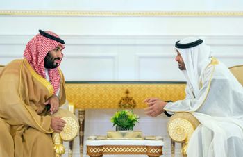 A handout picture provided by the Saudi Royal Palace on November 22, 2018, shows Saudi Crown Prince Mohammed bin Salman (L) meeting with Abu Dhabi's Crown Prince Sheikh Mohamed bin Zayed Al-Nahyan, upon the former's arrival in Abu Dhabi