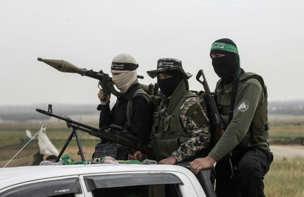 Members of the Ezzedine al-Qassam Brigades, the militant wing of the Palestinian Islamist movement Hamas, patrol in the southern Gaza Strip