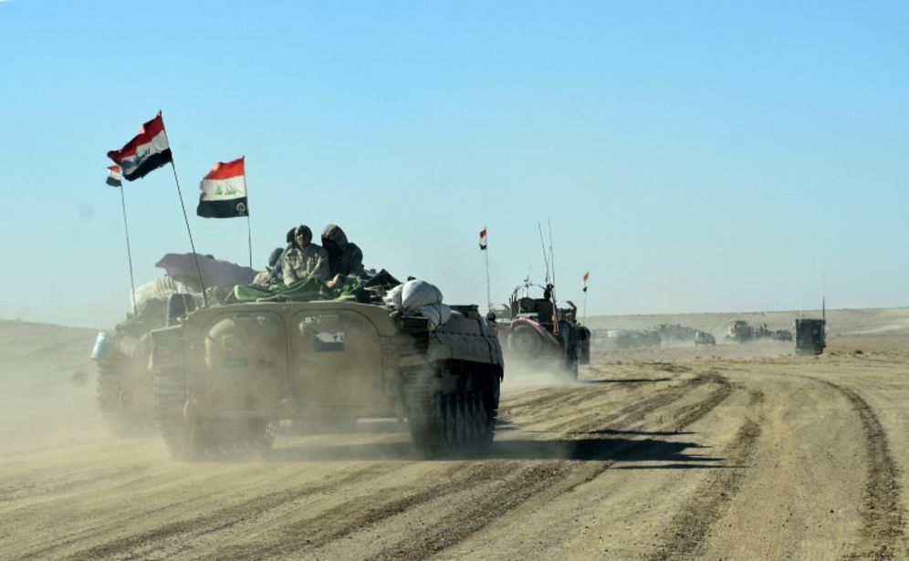 ستر (ا ف ب/ارشيف) عناصر من القوات العراقية والحشد الشعبي في آلية عسكرية قرب الحدود السورية في غرب العراق في صورة من الارشيف تعود الى التاسع من كانون الاول/ديسمبر 2017