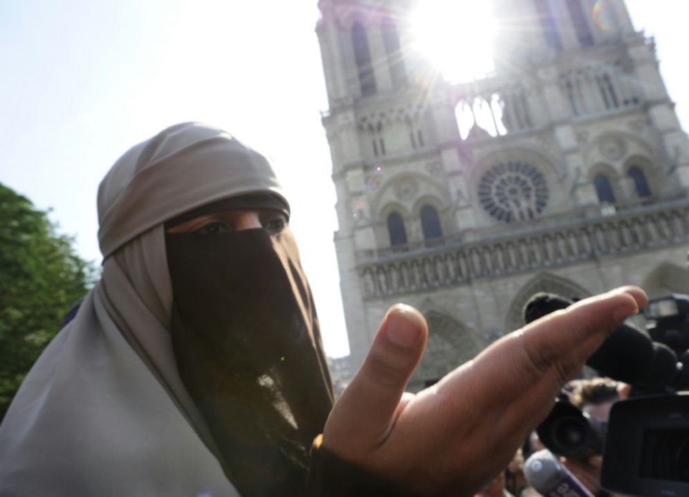 Many of France's five million Muslims feel they are targets for discrimination, a sense compounded by the nation's ban on face veils like the niquab worn by Kenza Driderduring a 2011 protest at Paris' Notre Dame cathedral
