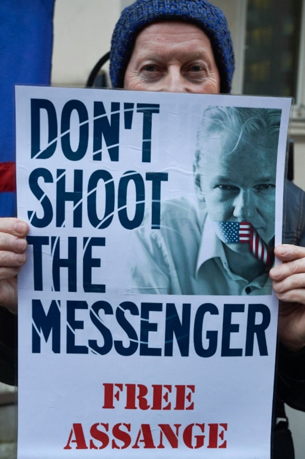 Niklas Halle'n (AFP) A supporter of WikiLeaks founder Julian Assange holds a poster outside Ecuador's embassy in London, on February 4, 2016