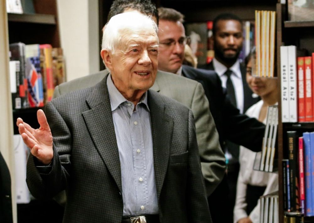Former US President Jimmy Carter arrives to sign his new Book "A Full Life: Reflections at Ninety" at Barnes & Noble on 5th avenue in New York on July 7, 2015 