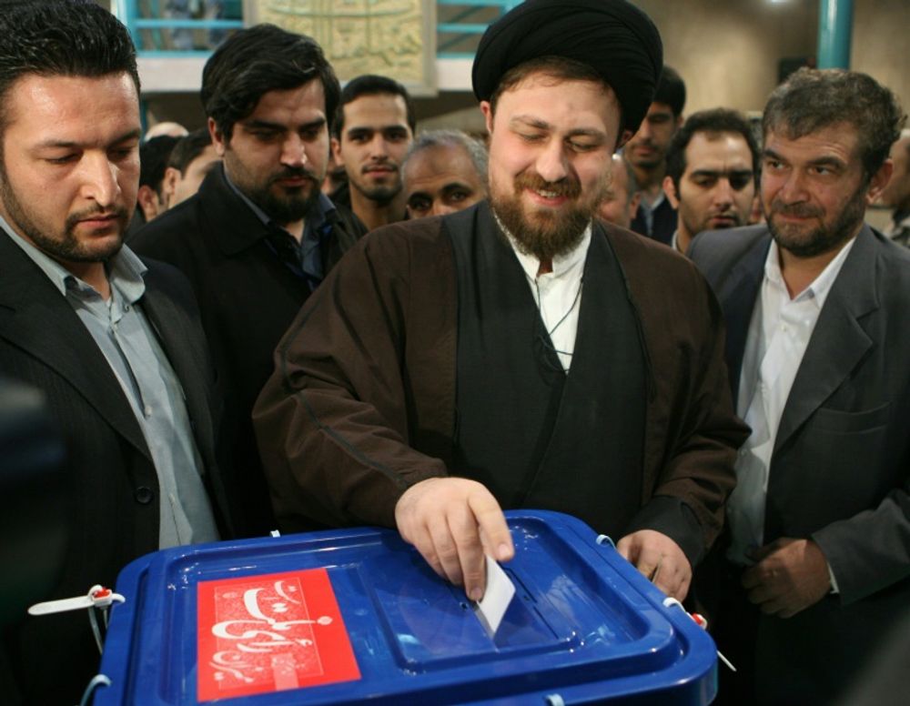 Hassan Khomeini (centre) is standing for a seat on Iran's top clerical body