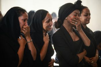 Women mourn during a memorial ceremony in Addis Ababa, Ethiopia on Monday March 11, 2019