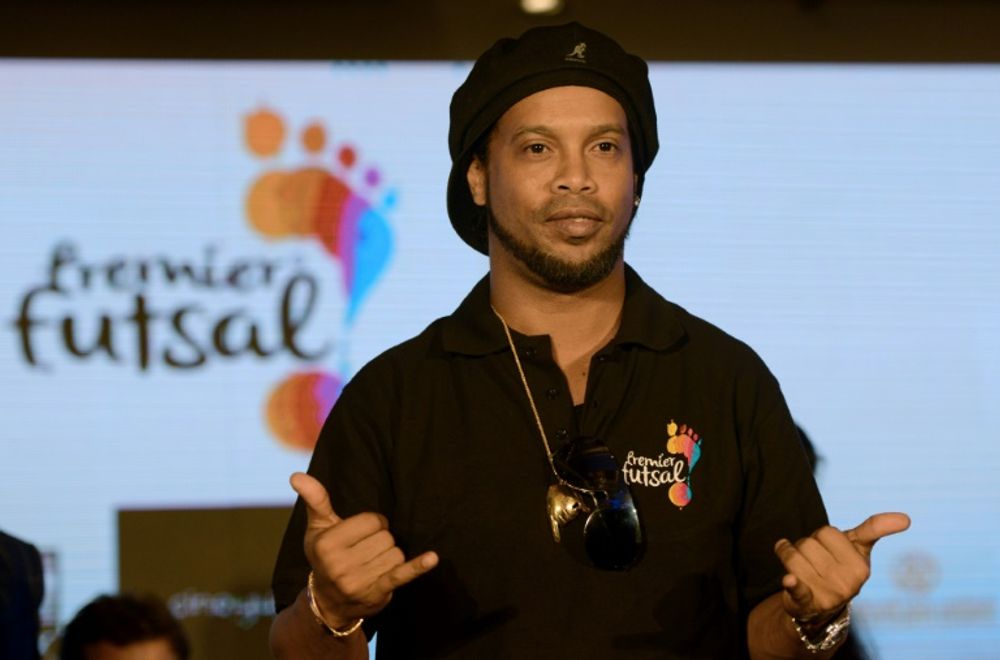 Brazilian soccer player Ronaldinho attends a press conference.