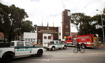 Police cars and a fire truck were parked outside General Santander Police Academy in Bogota one a day after the deadly car bombing blamed on leftist ELN guerrillas