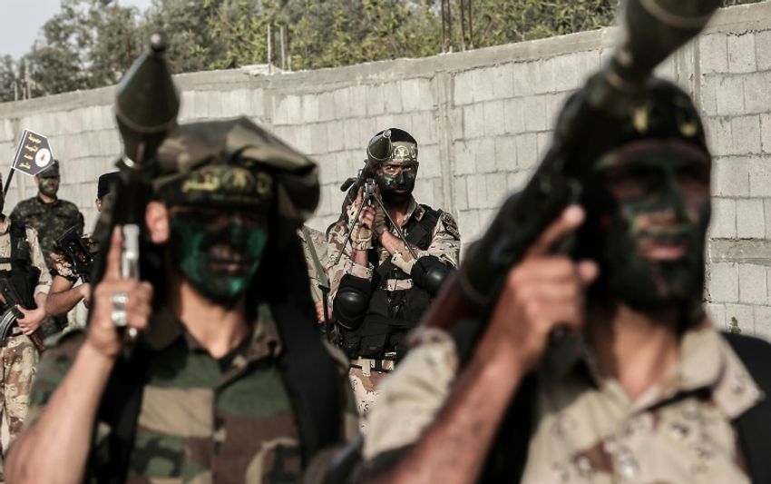 Members of the Palestinian Islamic Jihad movement march with rocket-propelled grenade launchers during a military drill in the Gaza Strip on March 27, 2018