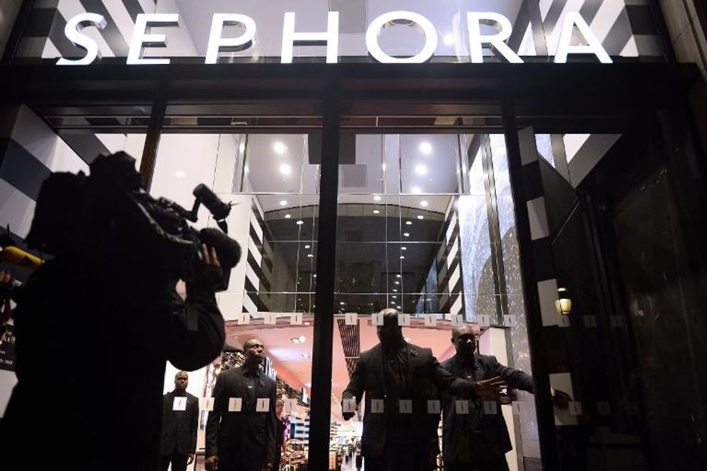 Lionel Bonaventure (AFP/File) Security guards shut the doors of French cosmetics maker Sephora's flagship store on the Champs-Elysees in Paris on October 9, 2013