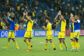 Maccabi Tel Aviv players greet their supporters at the end of the Champions League group G match against Porto in Haifa on November 4, 2015