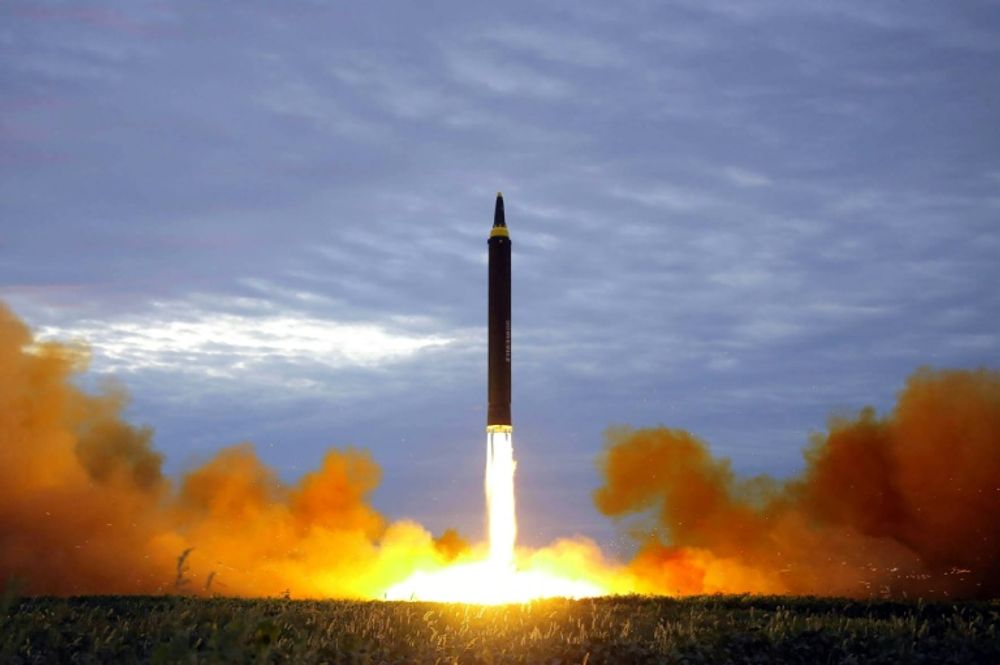 A North Korean official media image of the launch of an intermediate-range strategic ballistic rocket Hwasong-12 at an undisclosed location near Pyongyang in August