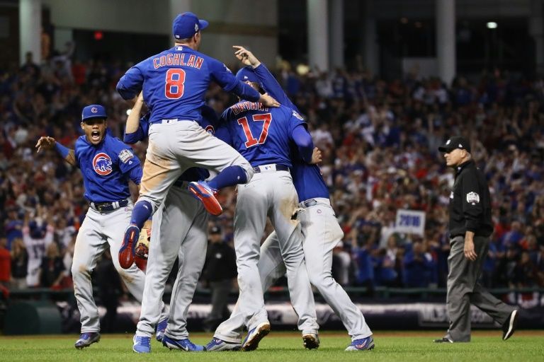 The Chicago Cubs celebrate after winning 8-7 in Game Seven of the