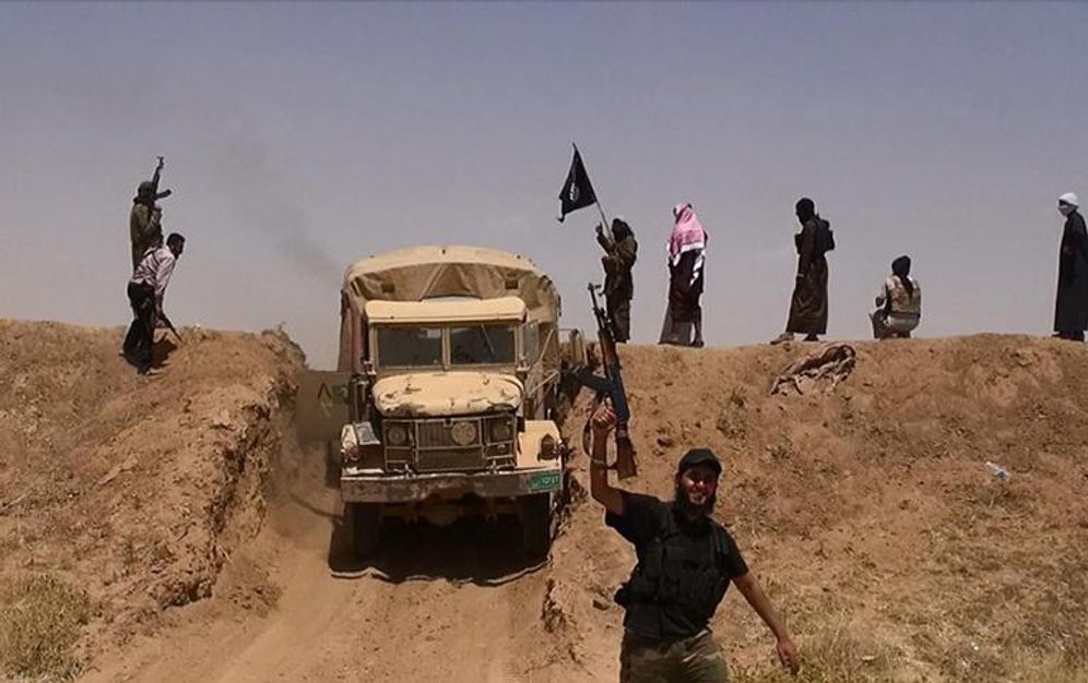 An Al-Baraka news image from June 11, 2014 allegedly shows militants of the jihadist group Islamic State of Iraq and the Levant (ISIL) driving through the Syrian-Iraqi border