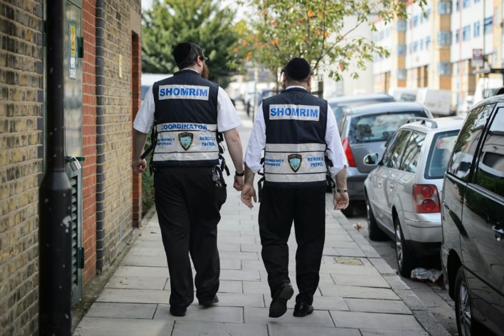 Members of the Jewish "Shomrim" neighbourhood security team pictured in Hackney, northeast London on August 27, 2014