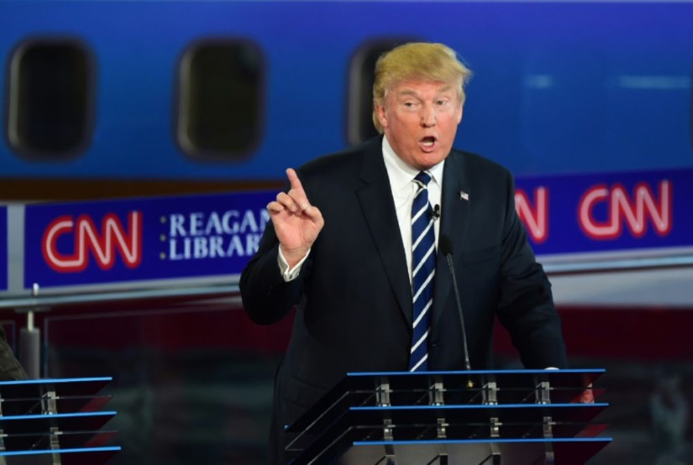 Republican presidential hopeful Donald Trump gestures during the Republican Presidential Debate at the Ronald Reagan Presidential Library in Simi Valley, California