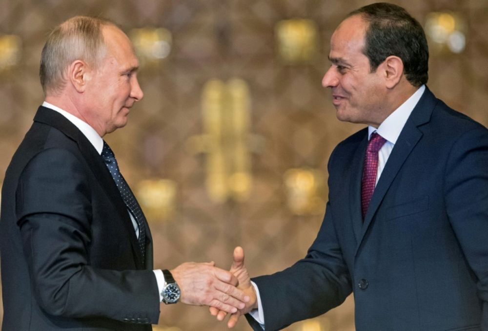 Russian President Vladimir Putin (L) shakes hands with Egyptian counterpart Abdel Fatah al-Sisi in Cairo, Egypt.