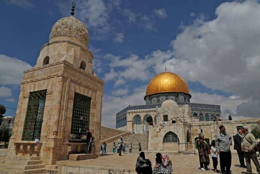 Palestinians gather near the Dome of the Rock in Jerusalem's Old City at the al-Aqsa mosque compound on May 13, 2018