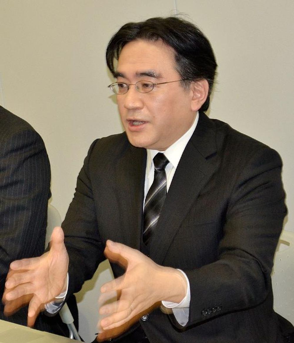 Nintendo President Satoru Iwata speaks as he unveils a Nintendo