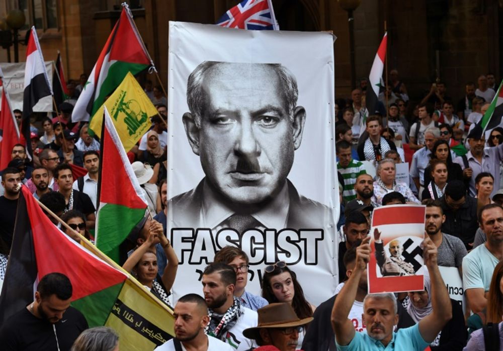 Pro-Palestinian activists demonstrate against a visit by Israel PM Benjamin Netanyahu, during a protest rally in Sydney, on February 23, 2017