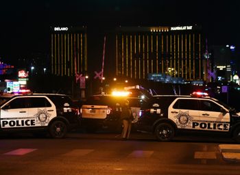 Police form a perimeter around the road leading to the Mandalay Hotel (background) after a gunman opened fire on a country music concert in Las Vegas, Nevada on October 2, 2017