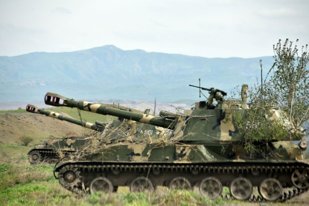 Mobile artillery units of the self-defence army of Nagorno-Karabakh hold a position outside the settlement of Hadrut, not far from the Iranian border, on April 5, 2016