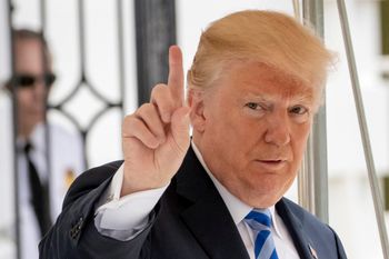 FILE: In this May 4, 2018 photo, President Donald Trump signals to the press that he will come over to talk, as he leaves the White House for Dallas to address the National Rifle Association in Washington. Trump is striking a combative tone against the Ru